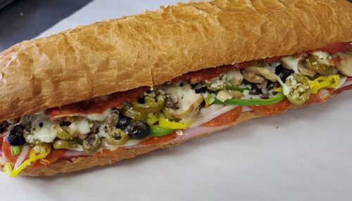 Vegetable sub sandwich with olives, mushrooms, tomato, peppers
